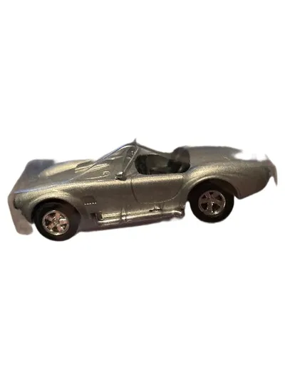 König Pilsener Shelby Cobra Modellauto Sportwagen Silber 1:64