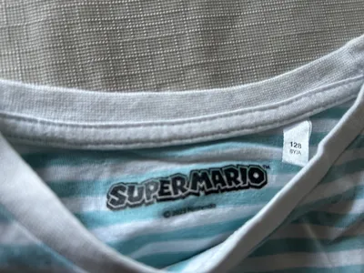 Super Mario Fanshirt It's-a me Mario Kinder T-Shirt Gr. 128 Blau gestreift