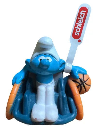 Schleich Spielfigur Schlumpf im Rollstuhl mit Ball Kinder Mehrfarbig