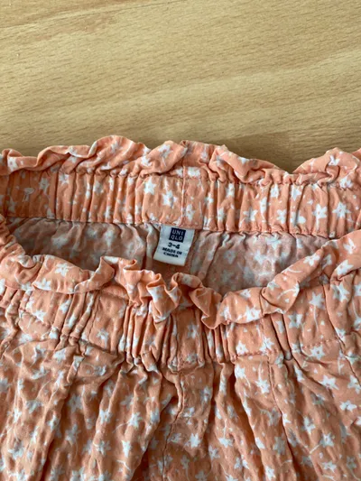 UNIQLO Kinder Shorts Blumenmuster Orange Gr. 104 Mädchen Sommer
